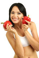 Girl with fresh peppers isolated on white