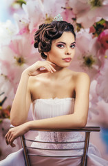 The bride, brunette sitting on a chair
