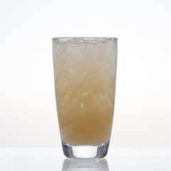 Fresh and cold passion fruit juice in glass isolated