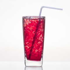 Fresh and cold pomegranate fruit juice in glass isolated