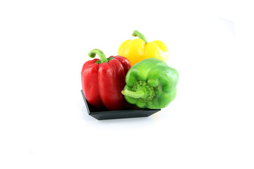 Three color of Bell pepper in a black dish.