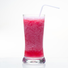 Cold and sweet strawberry shake soft drink in glass isolated