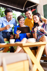 Group of young people in an Asian coffee shop