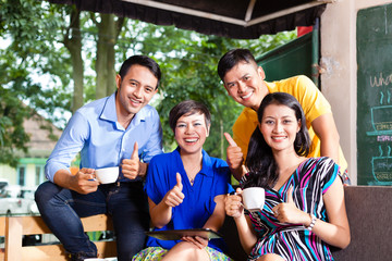 Group of young people in an Asian coffee shop