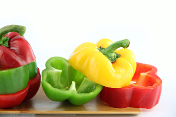 Zoom the Three color of bell pepper in the Bamboo dish.
