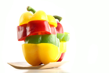 Slice the Three color of bell pepper in Arranged vertically.