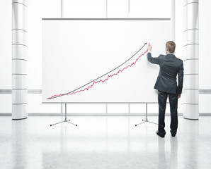 man drawing on white poster