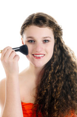 Young girl applying Make-Up