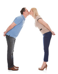 Portrait Of Young Couple Kissing