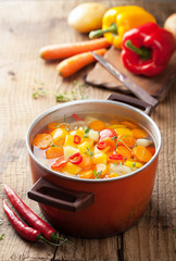 vegetable soup in red pot