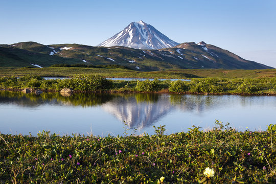 Viliuchinsky Volcano and the reflection in a mountain lake