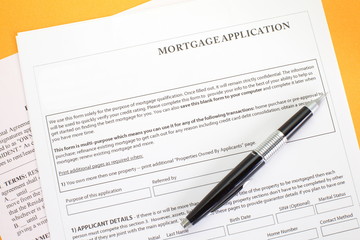 Close up of a mortgage application and a pen