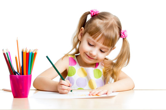 child girl drawing with colourful pencils