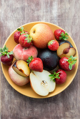 Fresh summer fruits in plate