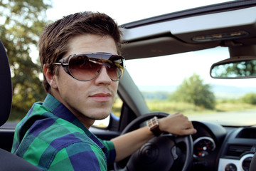 Handsome Man driving his car. Lifestyle, outdoors portrait