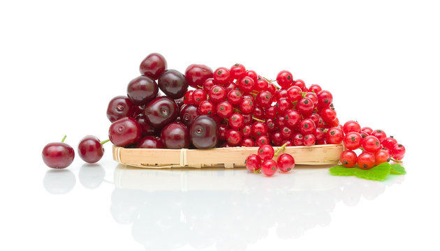 ripe cherry and currant on a white background