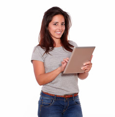 Smiling young woman using her tablet pc