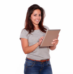 Fototapeta premium Smiling young woman using her tablet pc