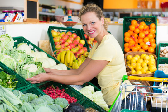 woman buys organic food