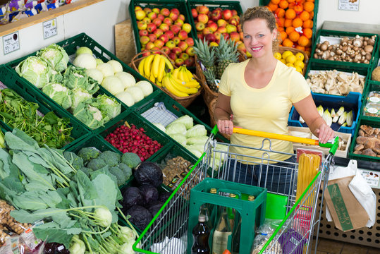 woman buys healthy food