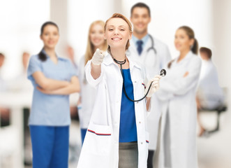 attractive female doctor pointing her finger