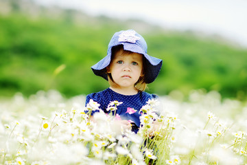 serious girl in field