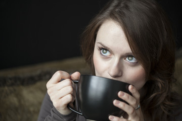 Young Woman with Black Coffee Cup