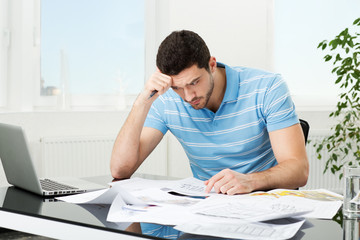 handsome young interior designer at workplace