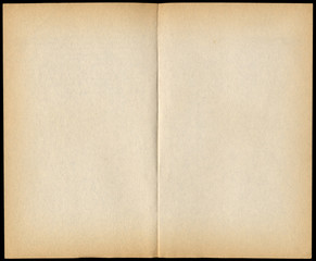 Two blank vintage paperback book pages isolated on black.