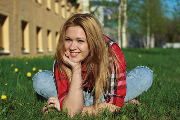 Fototapeta premium Happy smiling girl on the grass