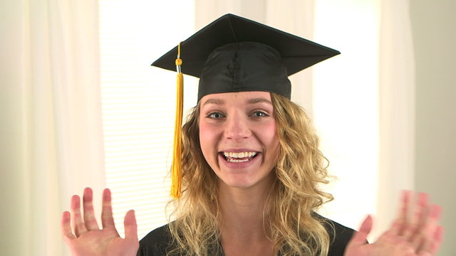 Excited blonde woman graduate