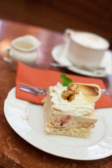 Cake with whipped cream and walnut