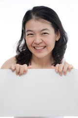 asian woman holding empty white board