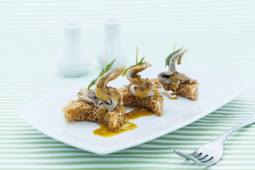 Duck slices with crispy noodle.