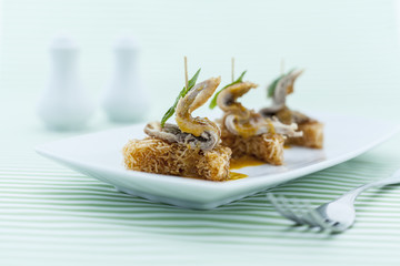Duck slices with crispy noodle.