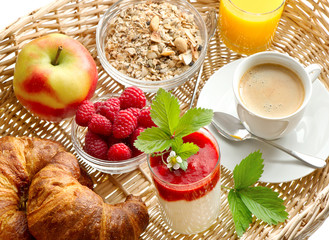 Breakfast with coffee, croissants, orange juice and yogurt