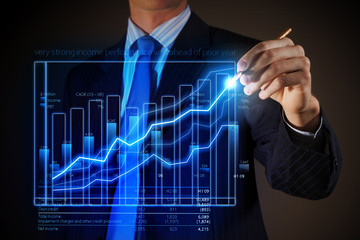 Business man drawing graphics
