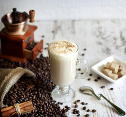 Cup of cappuccino on vintage white planks abstract still life