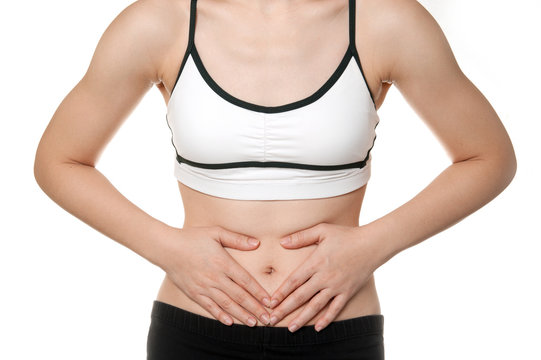 woman stomach ache in Sports wear isolated on white background