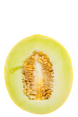 Honeydew cut in half over white background