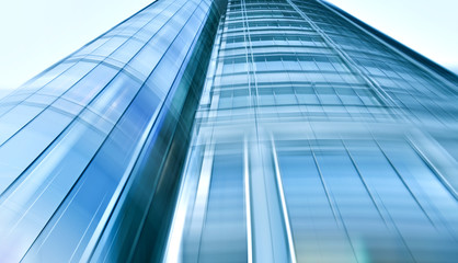 Fototapeta na wymiar Contemporary blue glass office building exterior