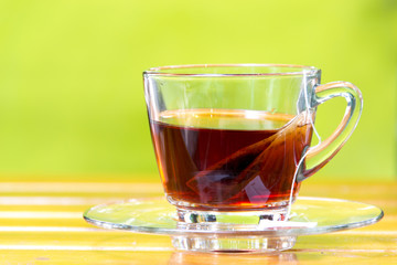 Tea bag in the cup with hot water