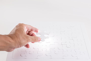 Missing jigsaw puzzle piece with light glow