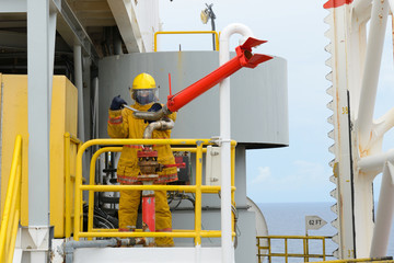 fireman is guarding for offshore helicopter before start up engi