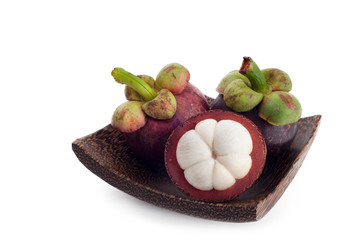 Mangosteen pulp on wood plate with white background