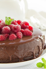 Chocolate cheesecake with raspberries.