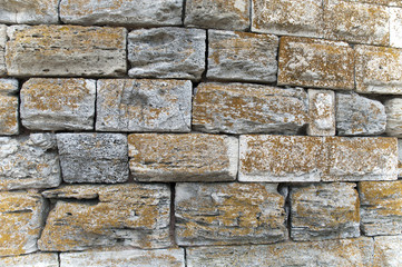 Fototapeta premium Old yellow granite stones wall using by texture