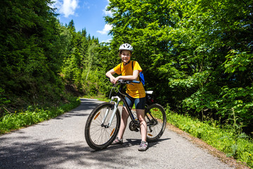 Naklejka premium Healthy lifestyle - teenage girl biking