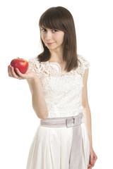 Portrait of young woman holding an apple