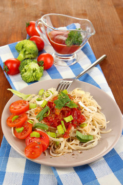 Tasty spaghetti with sauce and vegetables